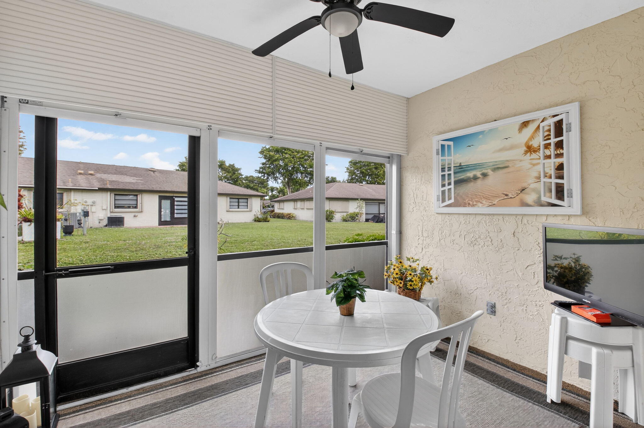 4972 Dovewood Road, Unit B Boynton Beach, FL 33436 - Photo 27 of 47 a view of a dining room with furniture and a potted plant