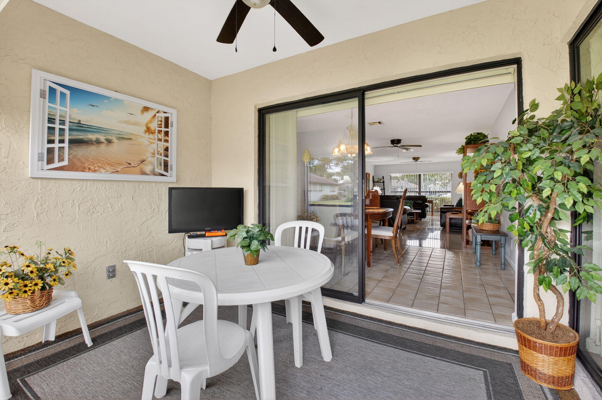 4972 Dovewood Road, Unit B Boynton Beach, FL 33436 - Photo 28 of 47 a dining room with furniture and a floor to ceiling window