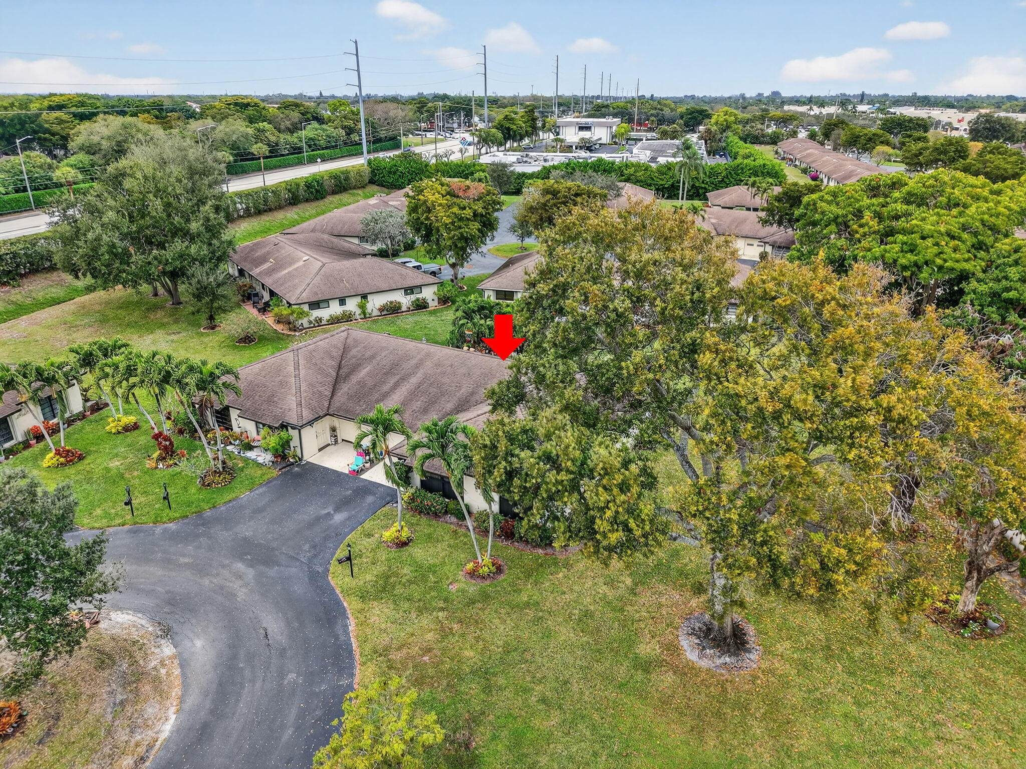 4972 Dovewood Road, Unit B Boynton Beach, FL 33436 - Photo 34 of 47 a view of a houses with a yard