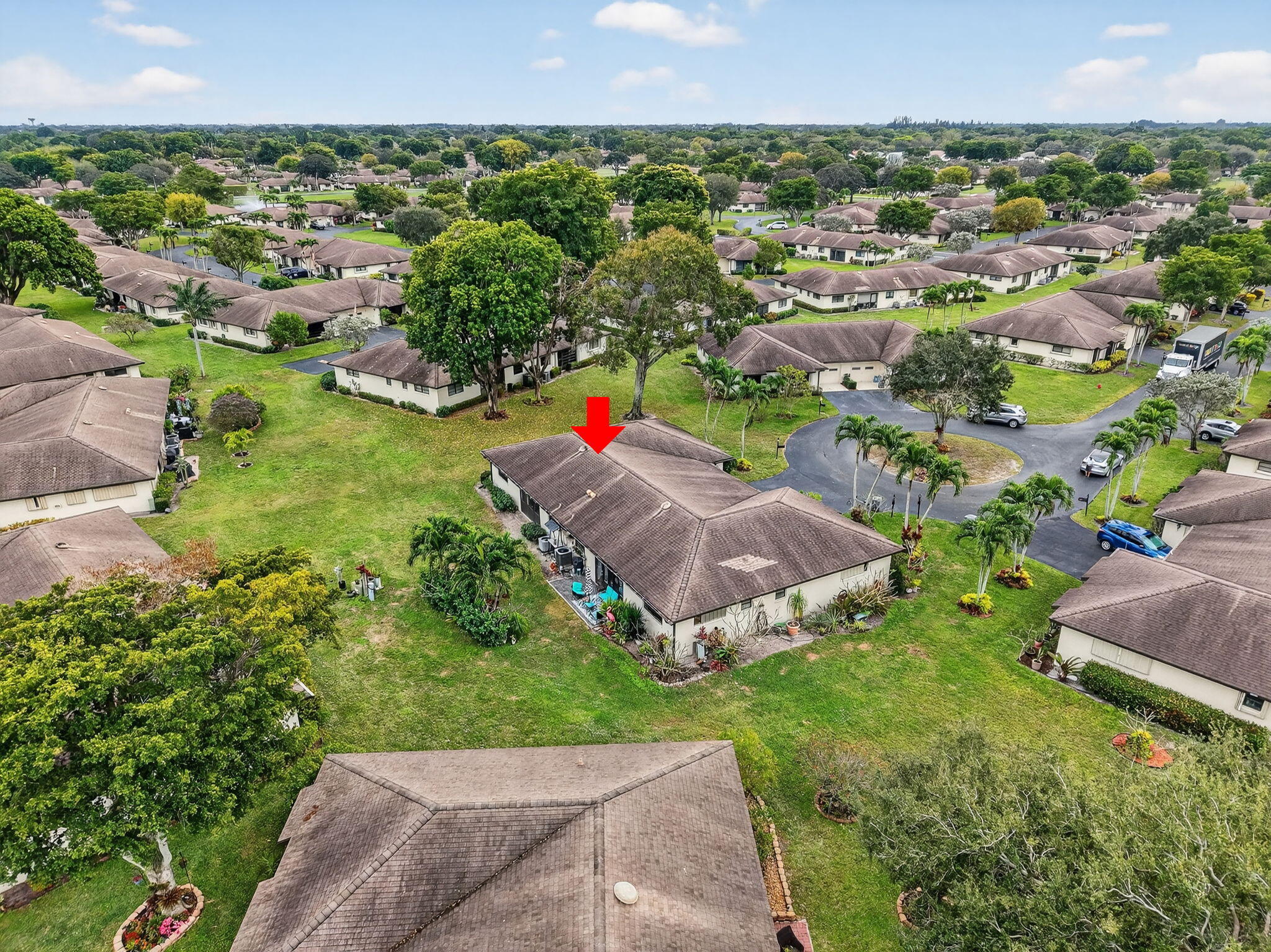 4972 Dovewood Road, Unit B Boynton Beach, FL 33436 - Photo 36 of 47 an aerial view of a houses with a yard