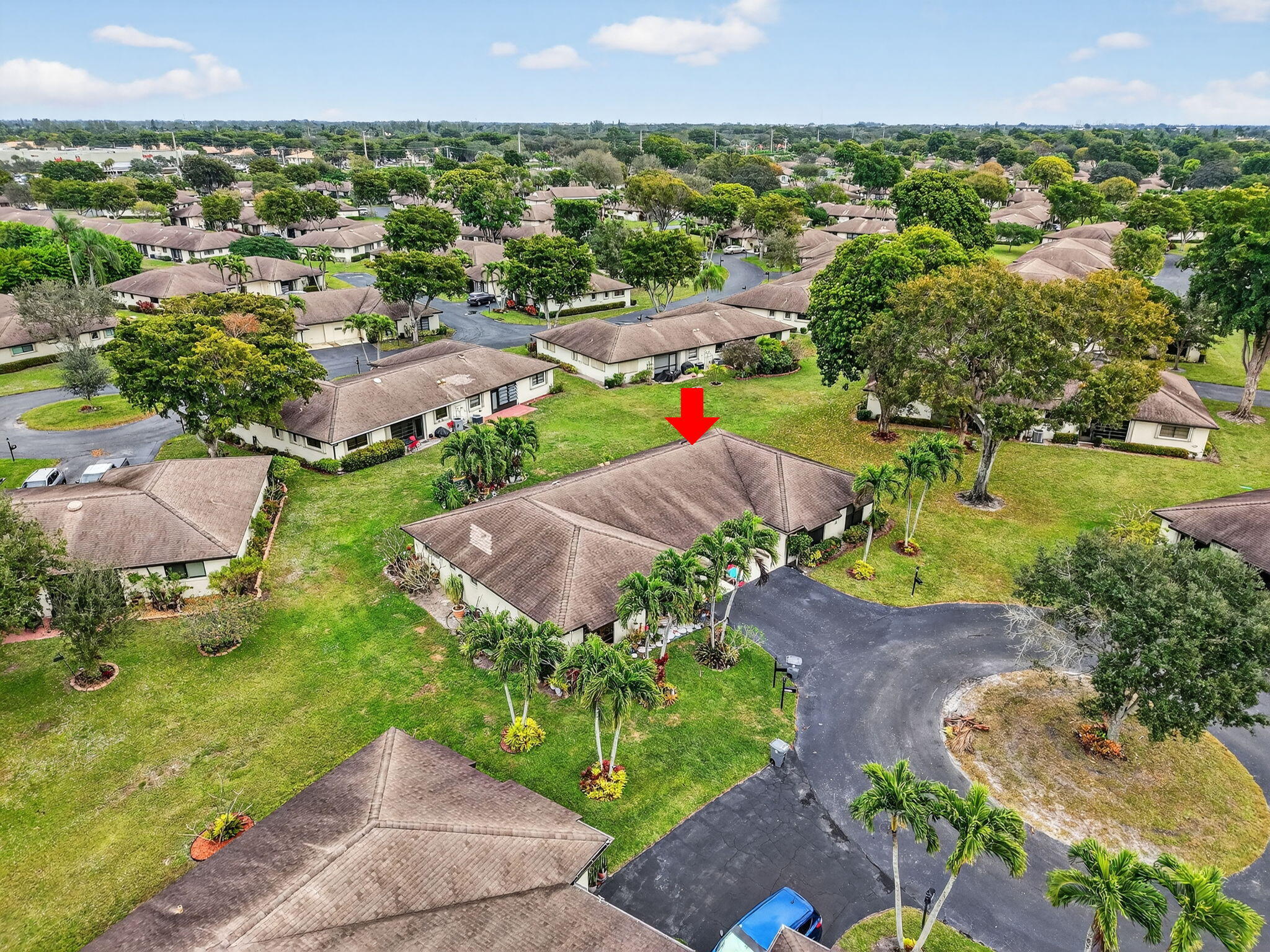 4972 Dovewood Road, Unit B Boynton Beach, FL 33436 - Photo 37 of 47 an aerial view of a houses with a yard