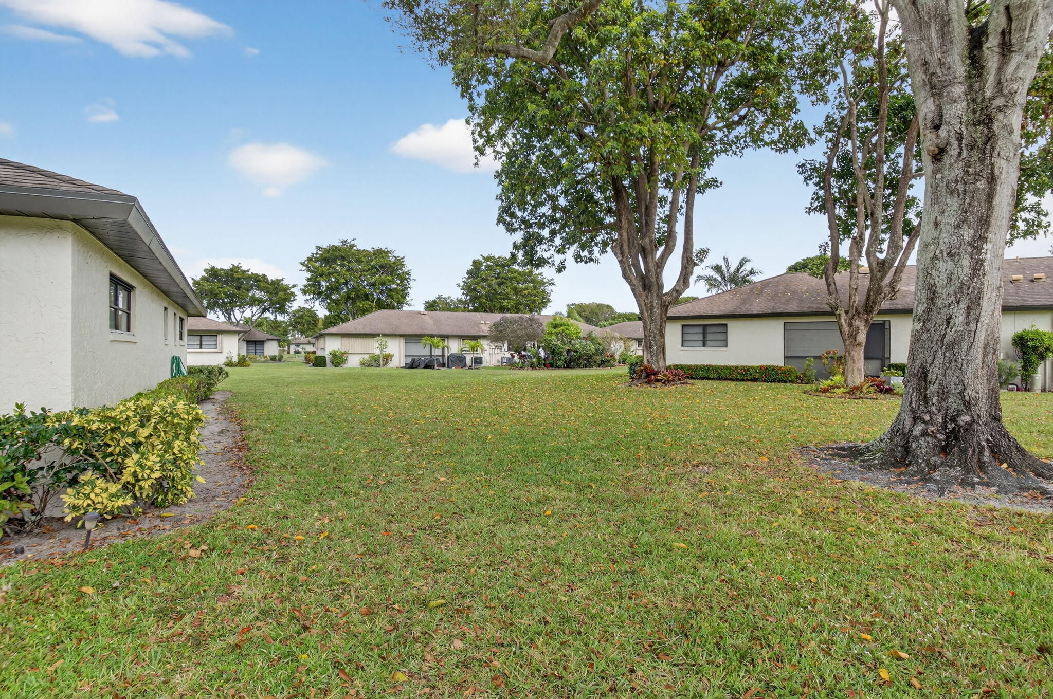4972 Dovewood Road, Unit B Boynton Beach, FL 33436 - Photo 4 of 47 a view of a house with backyard and garden