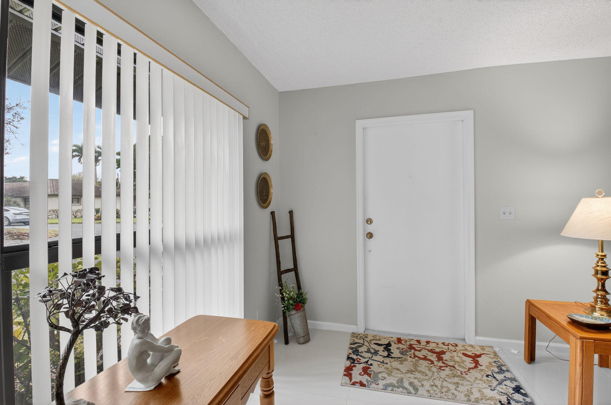 4972 Dovewood Road, Unit B Boynton Beach, FL 33436 - Photo 6 of 47 a bedroom with furniture and a window