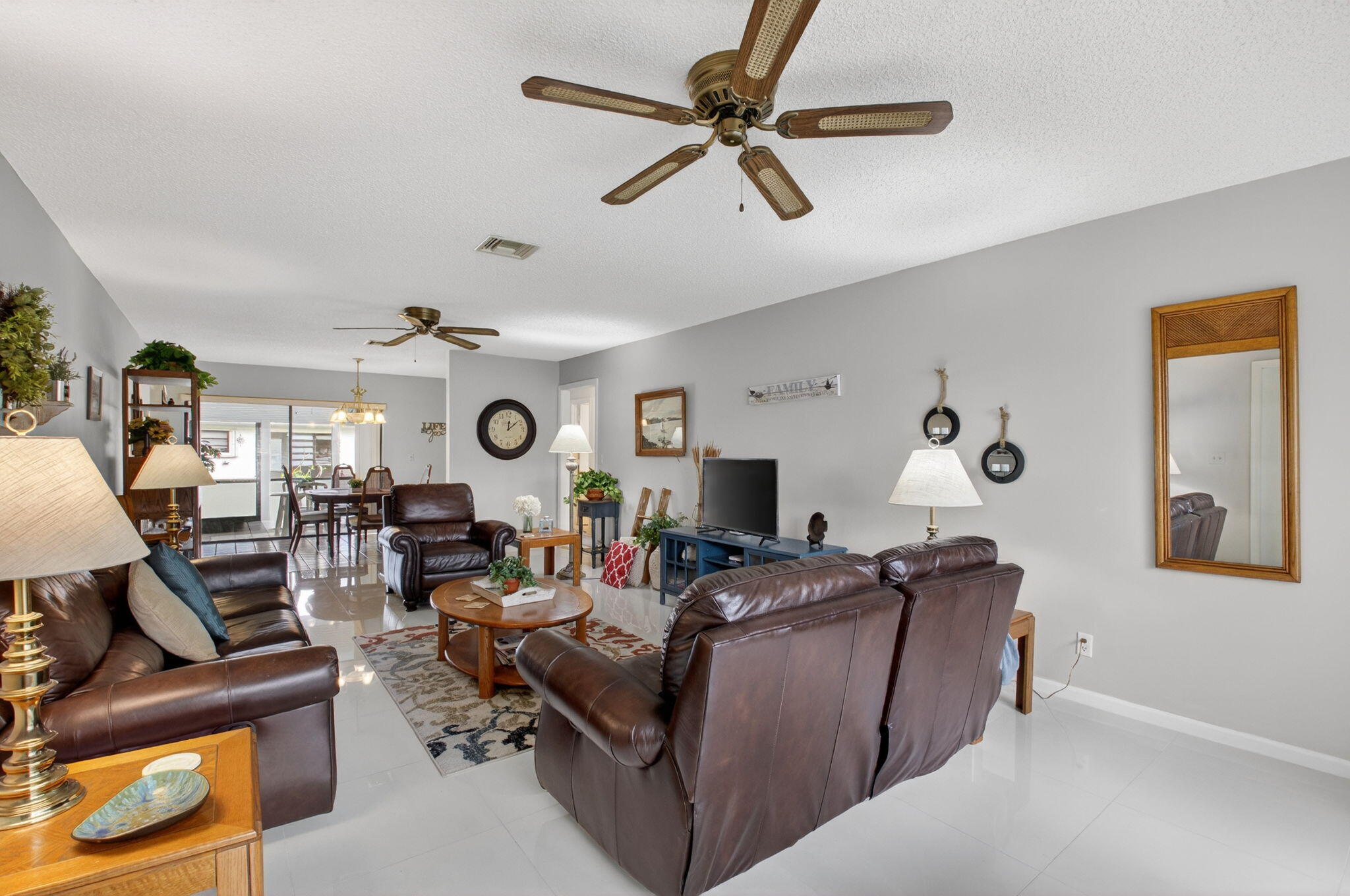 4972 Dovewood Road, Unit B Boynton Beach, FL 33436 - Photo 7 of 47 a living room with furniture and a flat screen tv