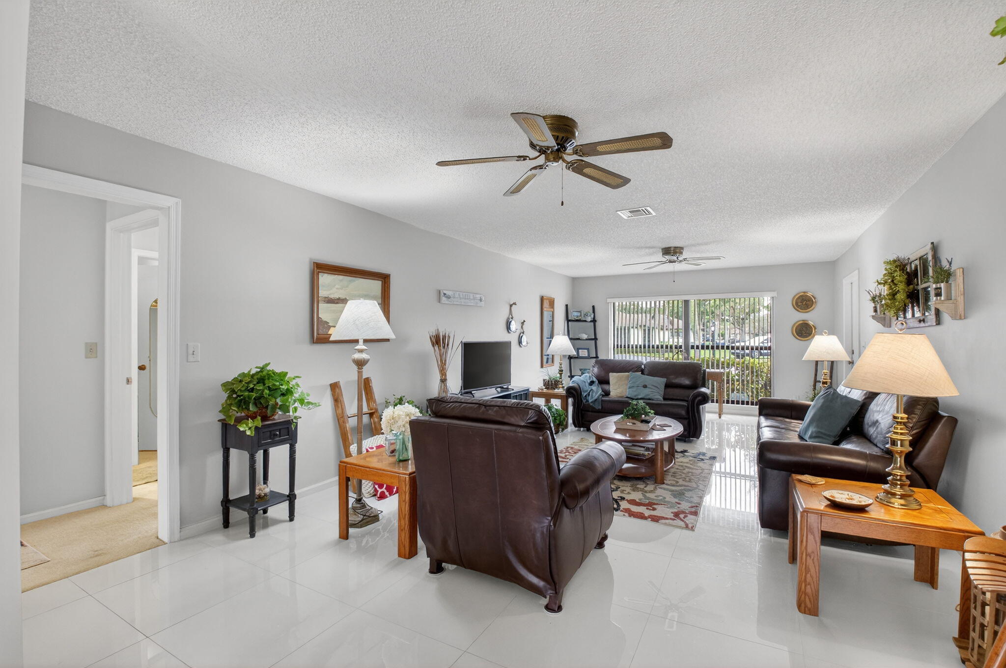 4972 Dovewood Road, Unit B Boynton Beach, FL 33436 - Photo 10 of 47 a living room with furniture and a window