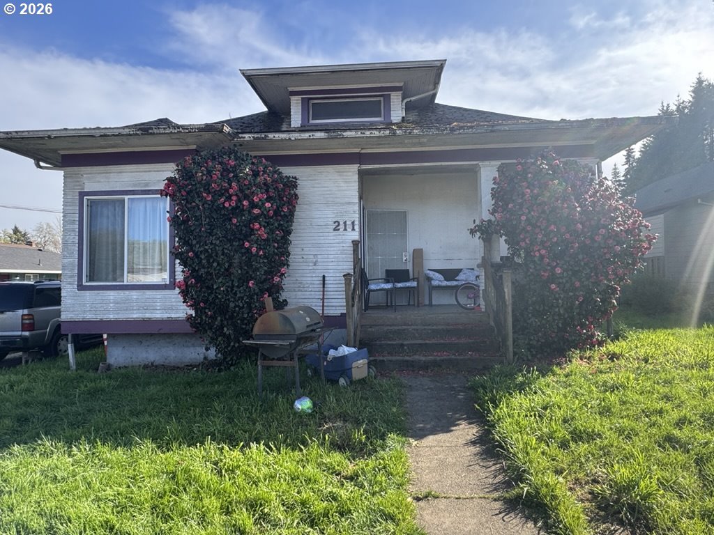 211 Church Street Amity, OR 97101 - Photo 1 of 7 a front view of a house with garden