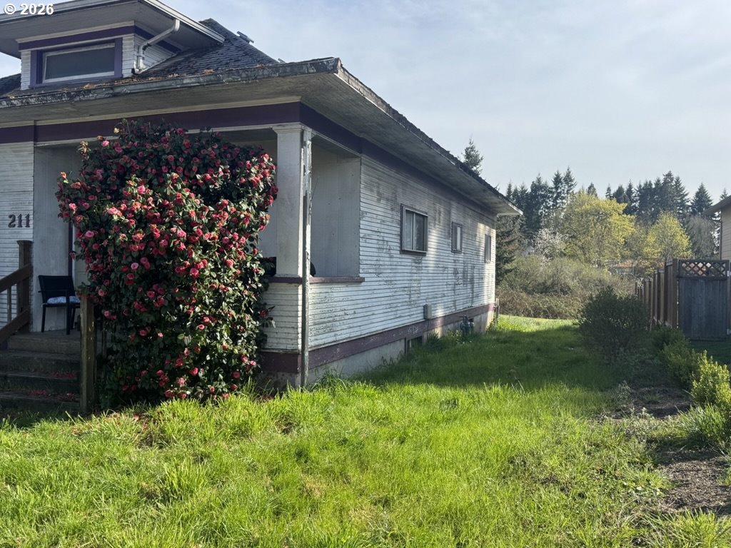 211 Church Street Amity, OR 97101 - Photo 2 of 7 a view of a backyard with plants and large trees