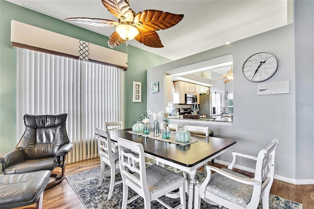 8472 Maybelle Drive Weeki Wachee, FL 34613 - Photo 16 of 58 a dining room with furniture and window