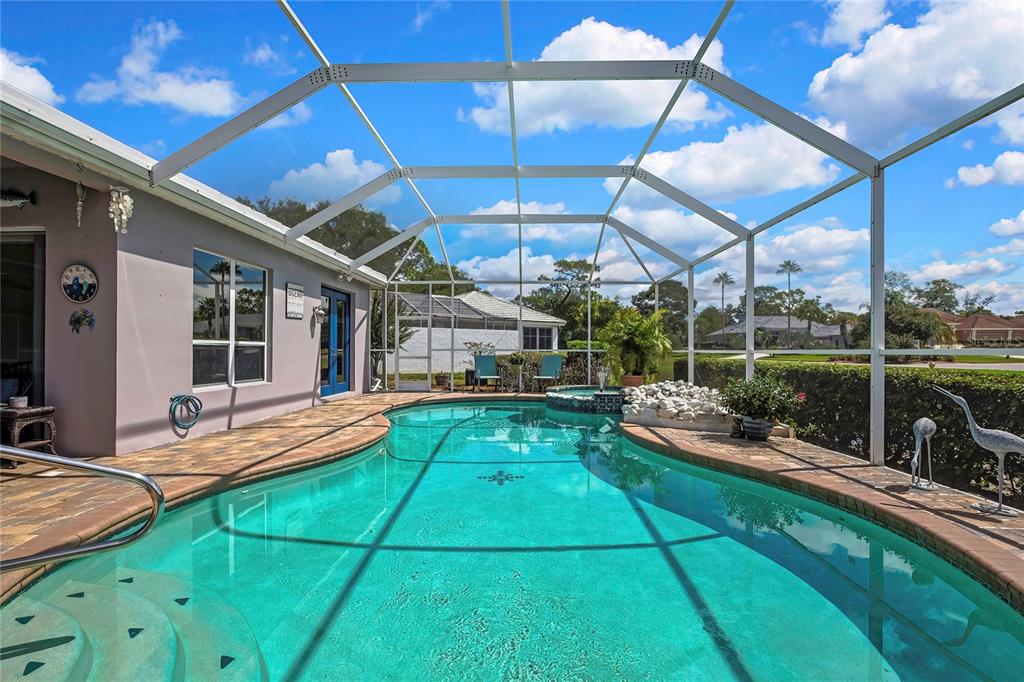 8472 Maybelle Drive Weeki Wachee, FL 34613 - Photo 40 of 58 a view of a backyard with pool table and chairs
