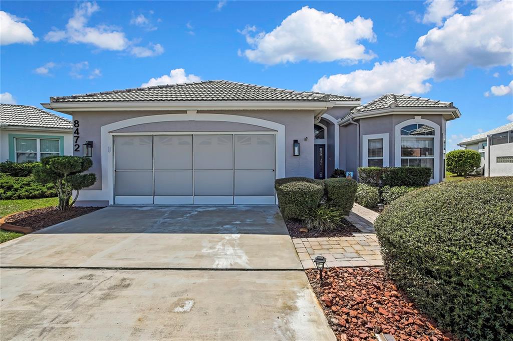 8472 Maybelle Drive Weeki Wachee, FL 34613 - Photo 42 of 58 a view of a white house with a outdoor space