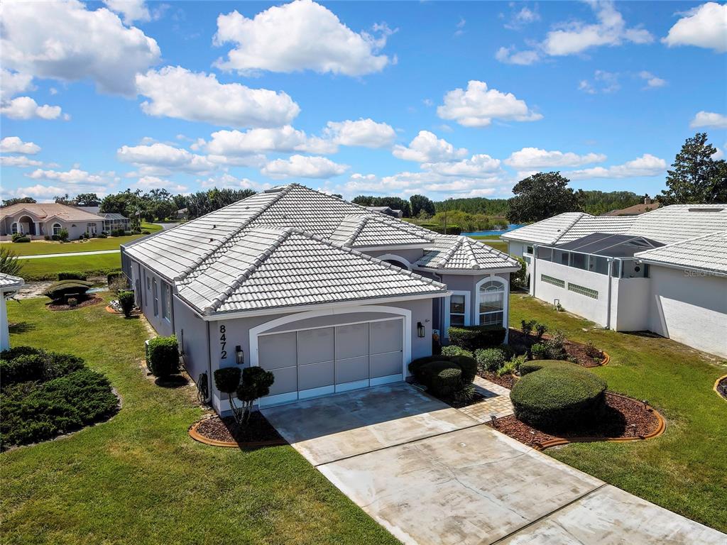 8472 Maybelle Drive Weeki Wachee, FL 34613 - Photo 45 of 58 a aerial view of a house with yard porch and furniture