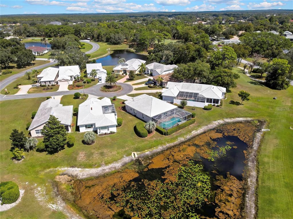 8472 Maybelle Drive Weeki Wachee, FL 34613 - Photo 52 of 58 an aerial view of residential houses with outdoor space