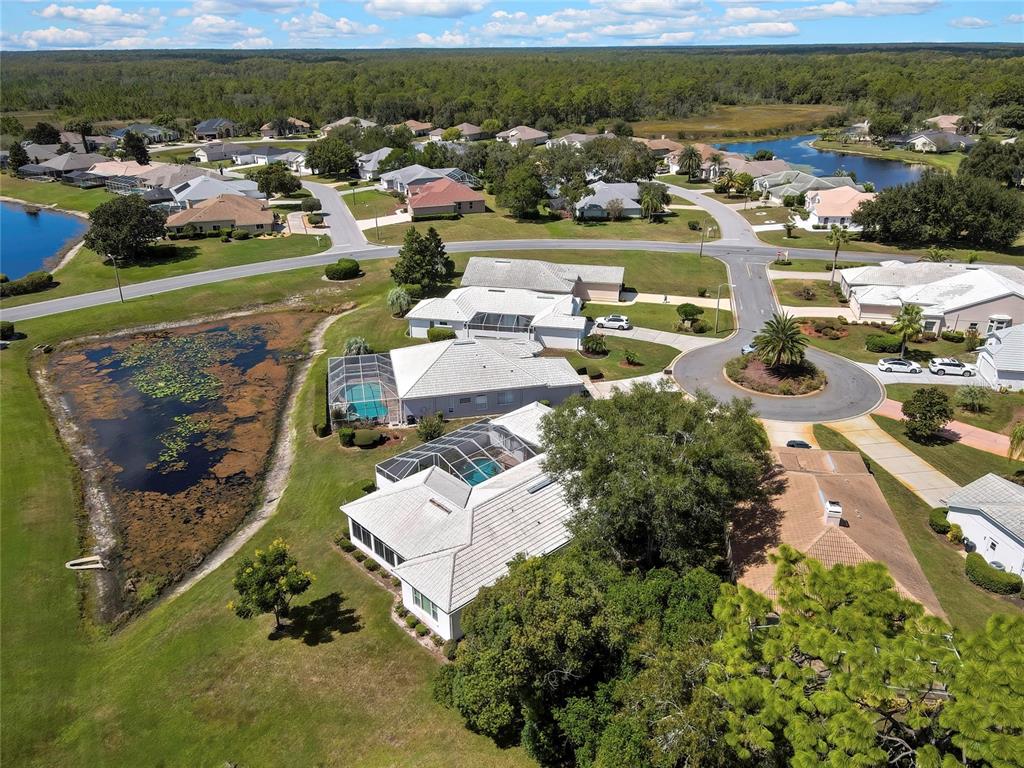 8472 Maybelle Drive Weeki Wachee, FL 34613 - Photo 54 of 58 an aerial view of a house with a garden
