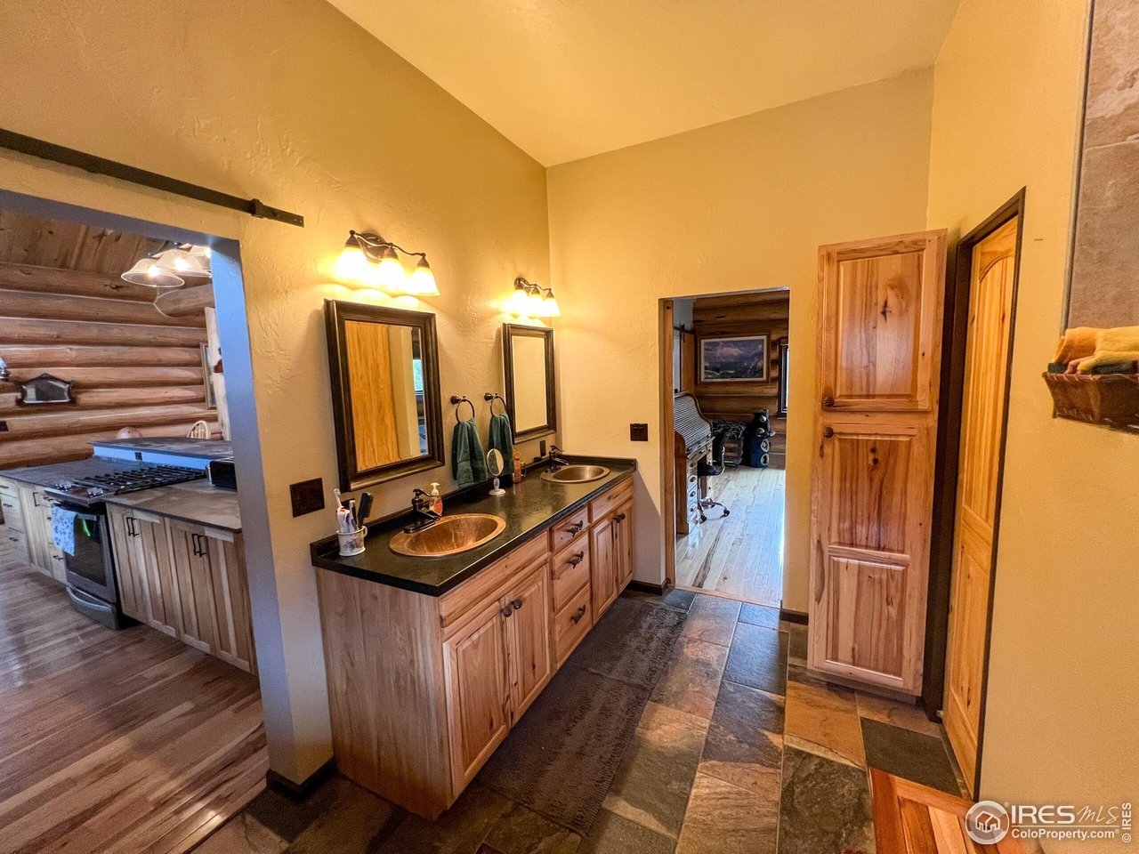 27667 Buckhorn Road Bellvue, CO 80512 - Photo 12 of 40 a kitchen with stainless steel appliances granite countertop a refrigerator and a stove