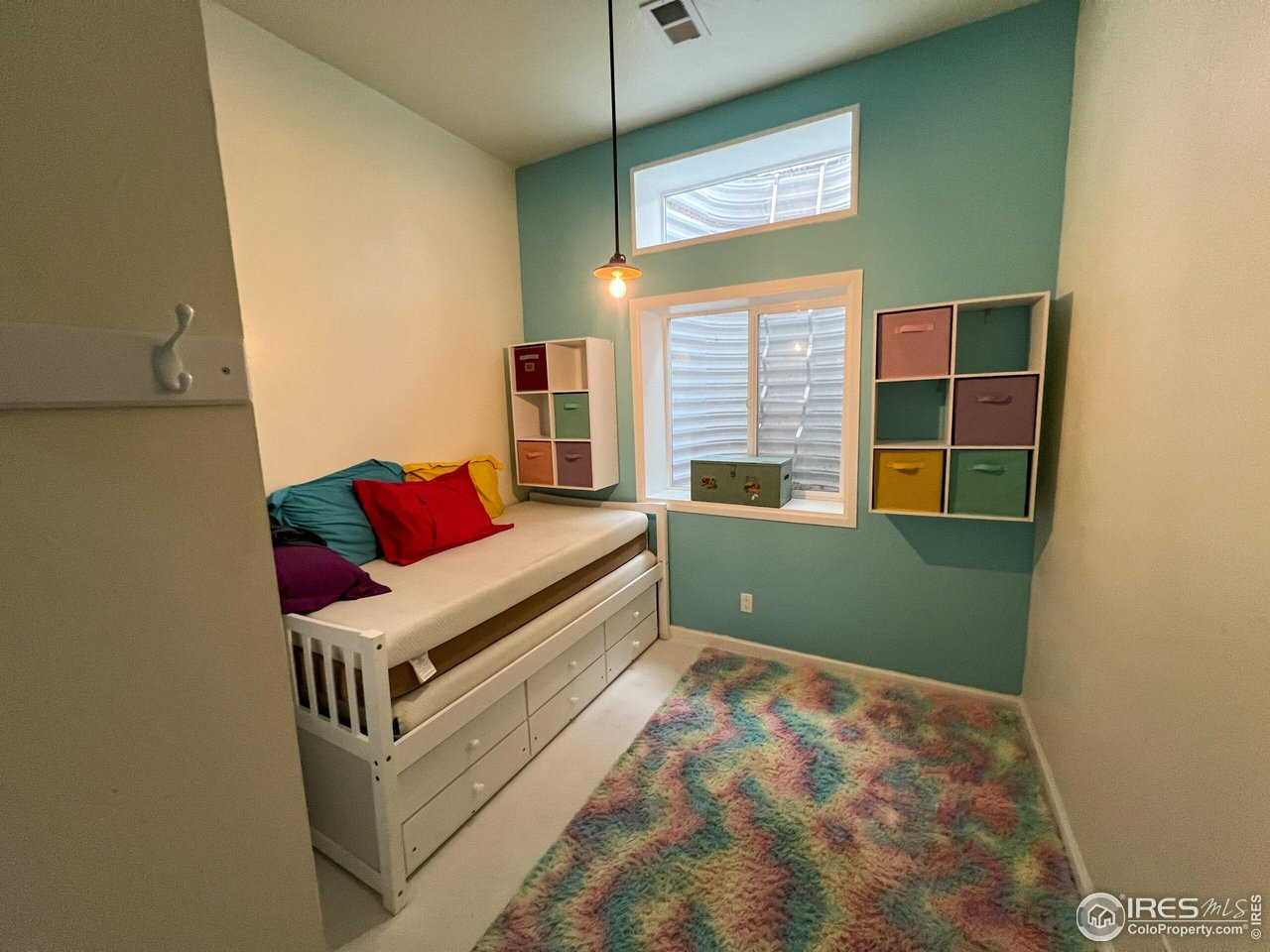 27667 Buckhorn Road Bellvue, CO 80512 - Photo 19 of 40 a living room with furniture and a window