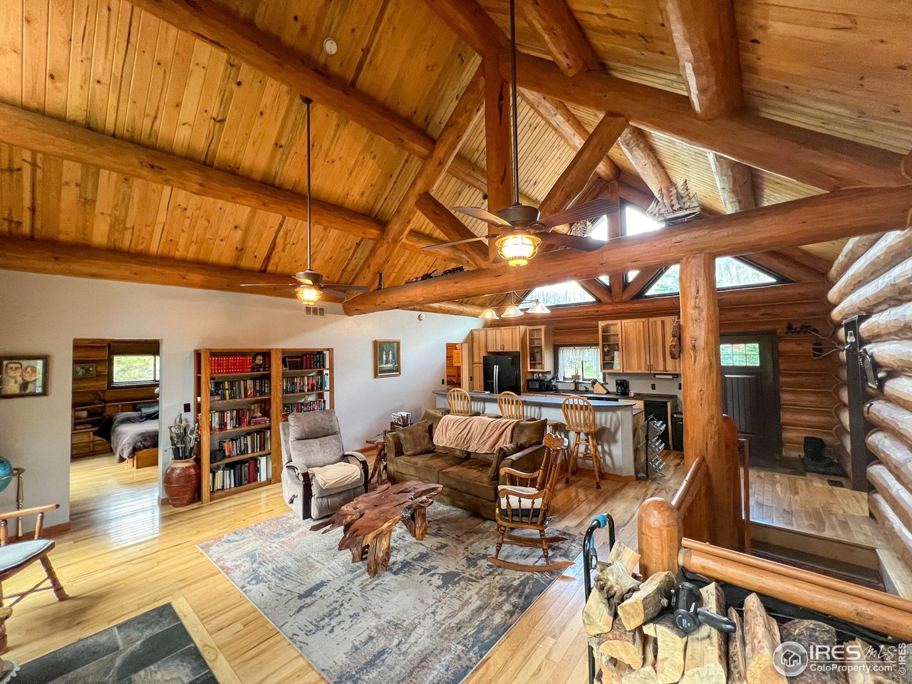 27667 Buckhorn Road Bellvue, CO 80512 - Photo 8 of 40 a living room with lots of furniture and kitchen view