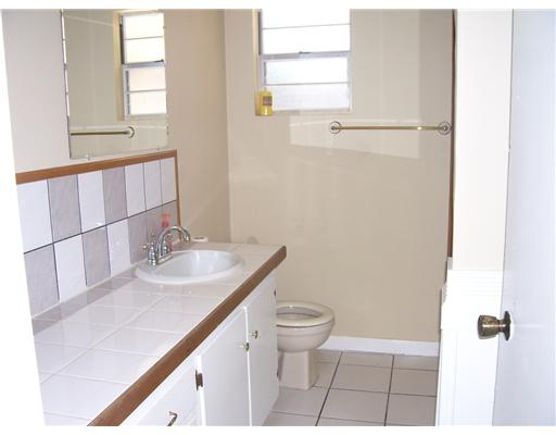 11217 Guess Drive Corpus Christi, TX 78410 - Photo 10 of 10 a bathroom with a sink a toilet and window