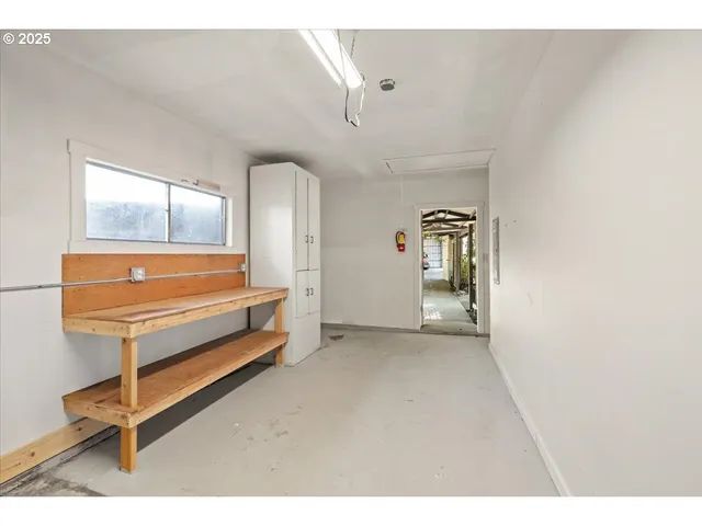 a view of room with stairs and furniture
