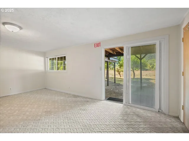 a view of an empty room and window