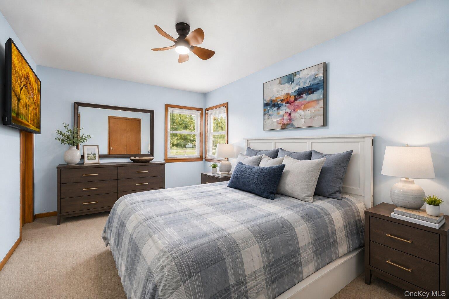 49 Chase Road Wallkill, NY 12589 - Photo 11 of 32 Virtually Staged Primary Bedroom: Comfortable primary bedroom with soft carpeting, generous closet space, a ceiling fan, and room for a complete bedroom set.