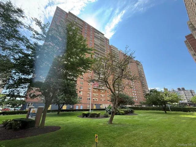 a view of a building with a yard