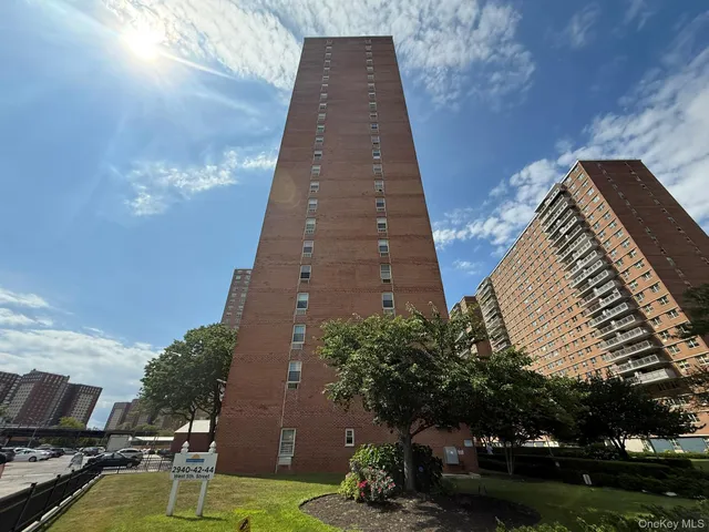 a swimming pool with outdoor seating and yard