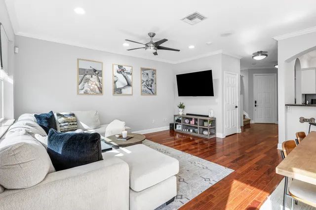 a kitchen with white cabinets stainless steel appliances and sink