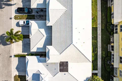 an aerial view of residential houses with outdoor space