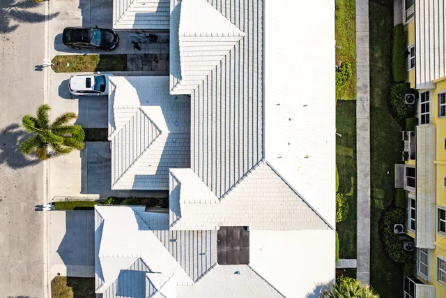an aerial view of residential houses with outdoor space