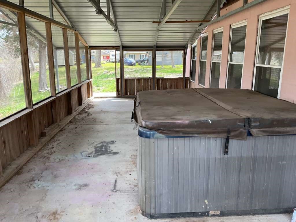 3303 St Anne Street Liverpool, TX 77577 - Photo 6 of 10 a view of a porch with furniture and floor to ceiling window