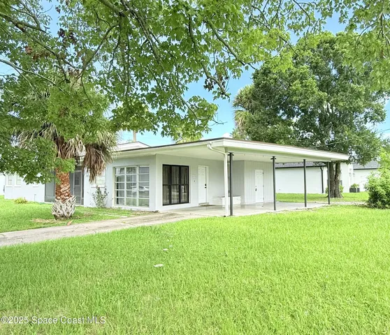 front view of a house with a yard