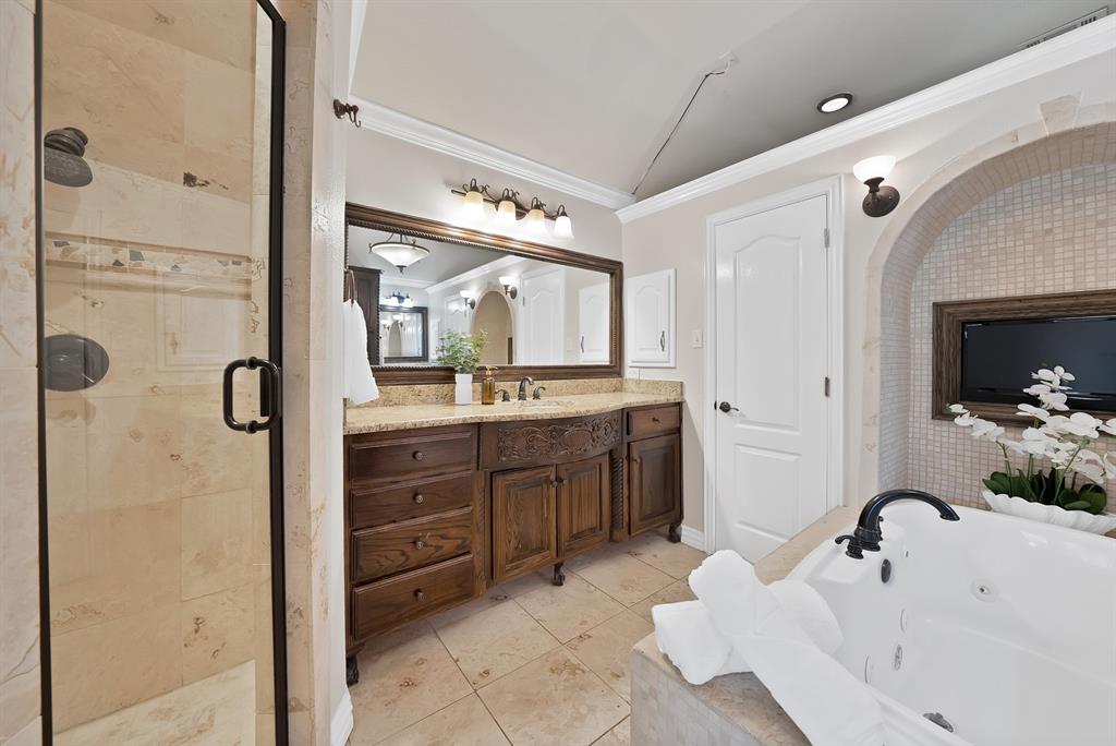 1110 McCampbell Road Mansfield, TX 76063 - Photo 32 of 39 a bathroom with a sink vanity granite tub and shower