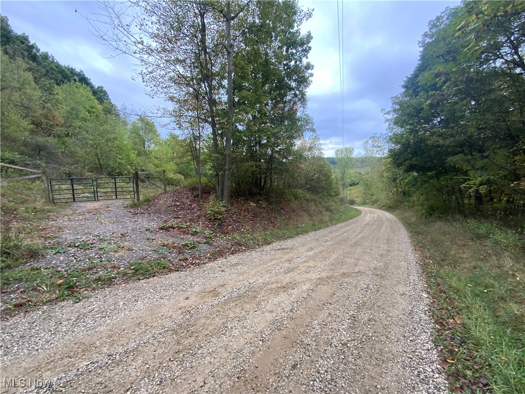 Taylor Road Dennison, OH 44621 - Photo 2 of 27 View of road with a gate and a wooded view