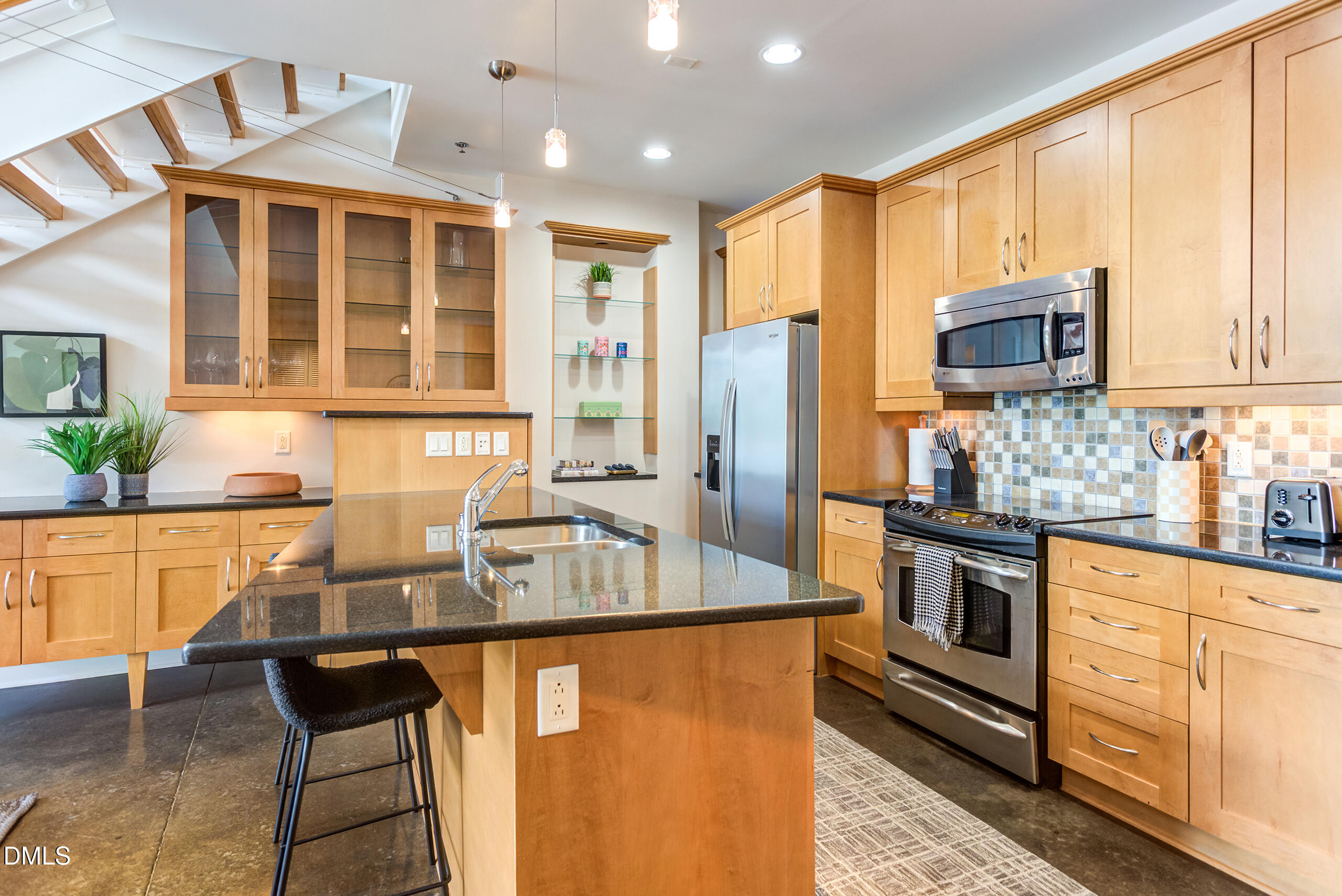 2608 Erwin Road, Unit 417 Durham, NC 27705 - Photo 6 of 50 a kitchen with stainless steel appliances granite countertop a stove a sink dishwasher a refrigerator and cabinets with wooden floor