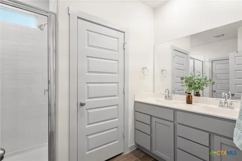 a bathroom with a sink and a mirror