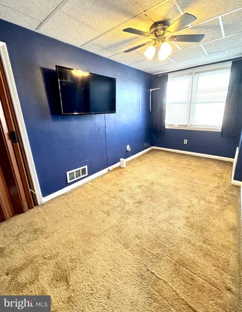 a view of a livingroom with a flat screen tv