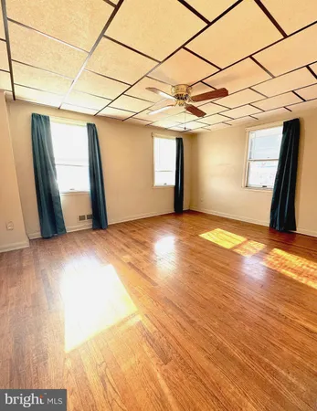 a view of a room with a wooden floor