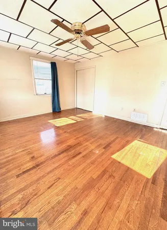 a view of a room with a wooden floor