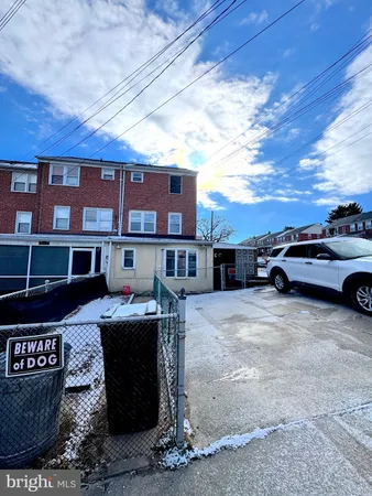 a front view of a house with parking space
