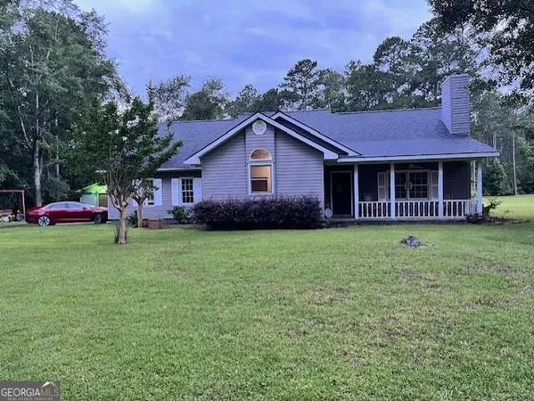 a view of a house with a garden