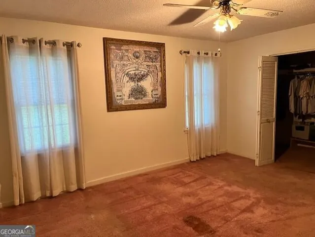 a bathroom with a sink vanity mirror and toilet