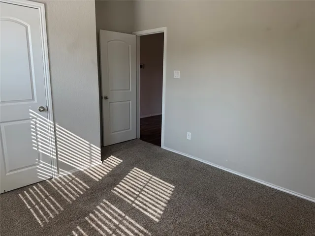 a view of wooden floor and chair in a room