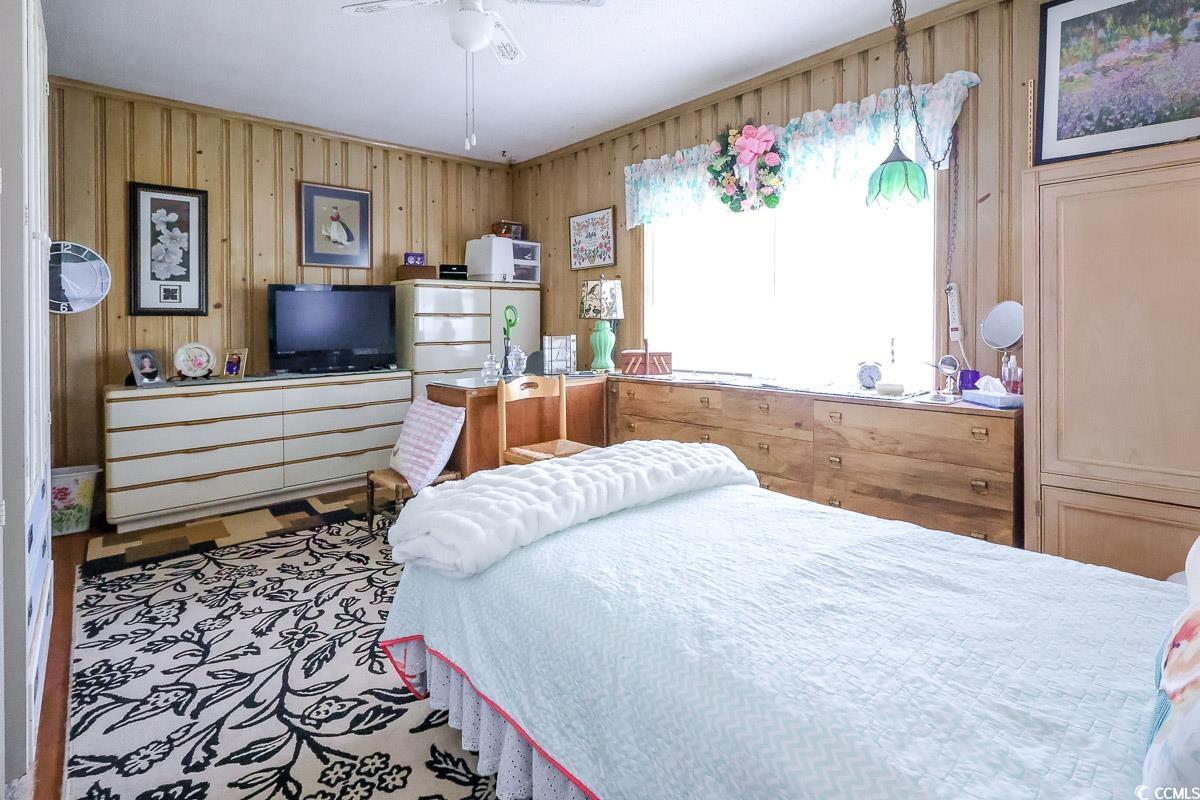 404 13th Avenue South Myrtle Beach, SC 29577 - Photo 16 of 39 Bedroom featuring wooden walls