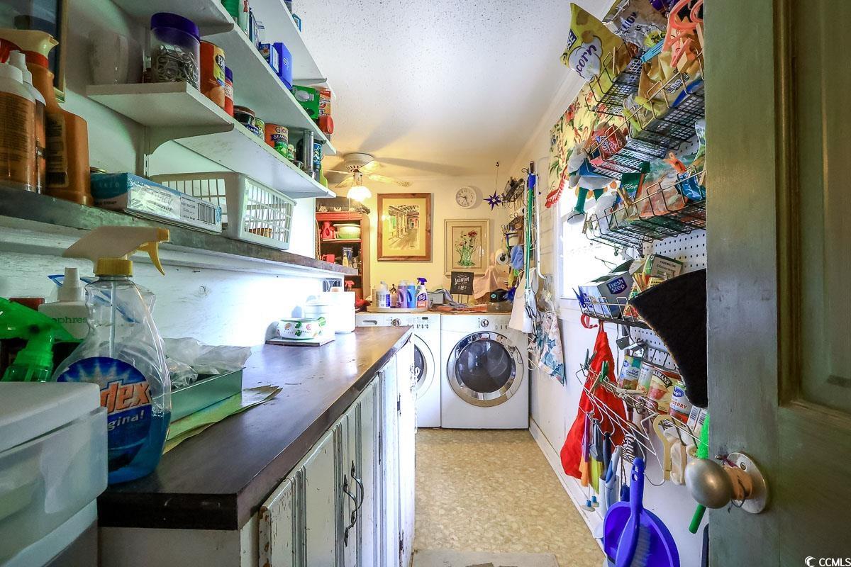 404 13th Avenue South Myrtle Beach, SC 29577 - Photo 20 of 39 Laundry room with washer and clothes dryer, a ceiling fan, and healthy amount of natural light