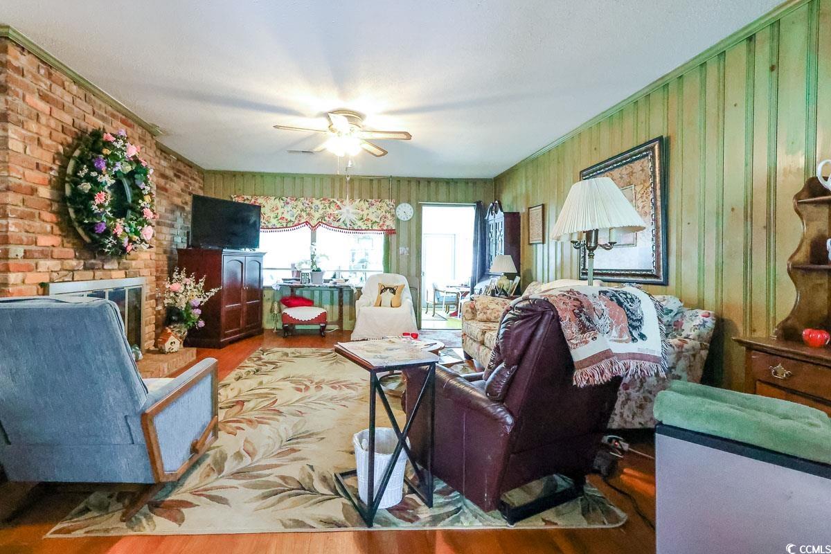 404 13th Avenue South Myrtle Beach, SC 29577 - Photo 3 of 39 Living area featuring wood finished floors and ceiling fan