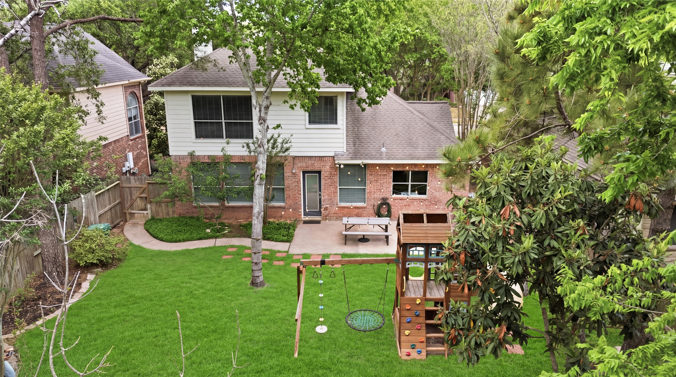 20907 Nettlebrook Lane Katy, TX 77450 - Photo 41 of 46 From above, the backyard unfolds like a private sanctuary framed by mature trees that create a sense of seclusion and calm.