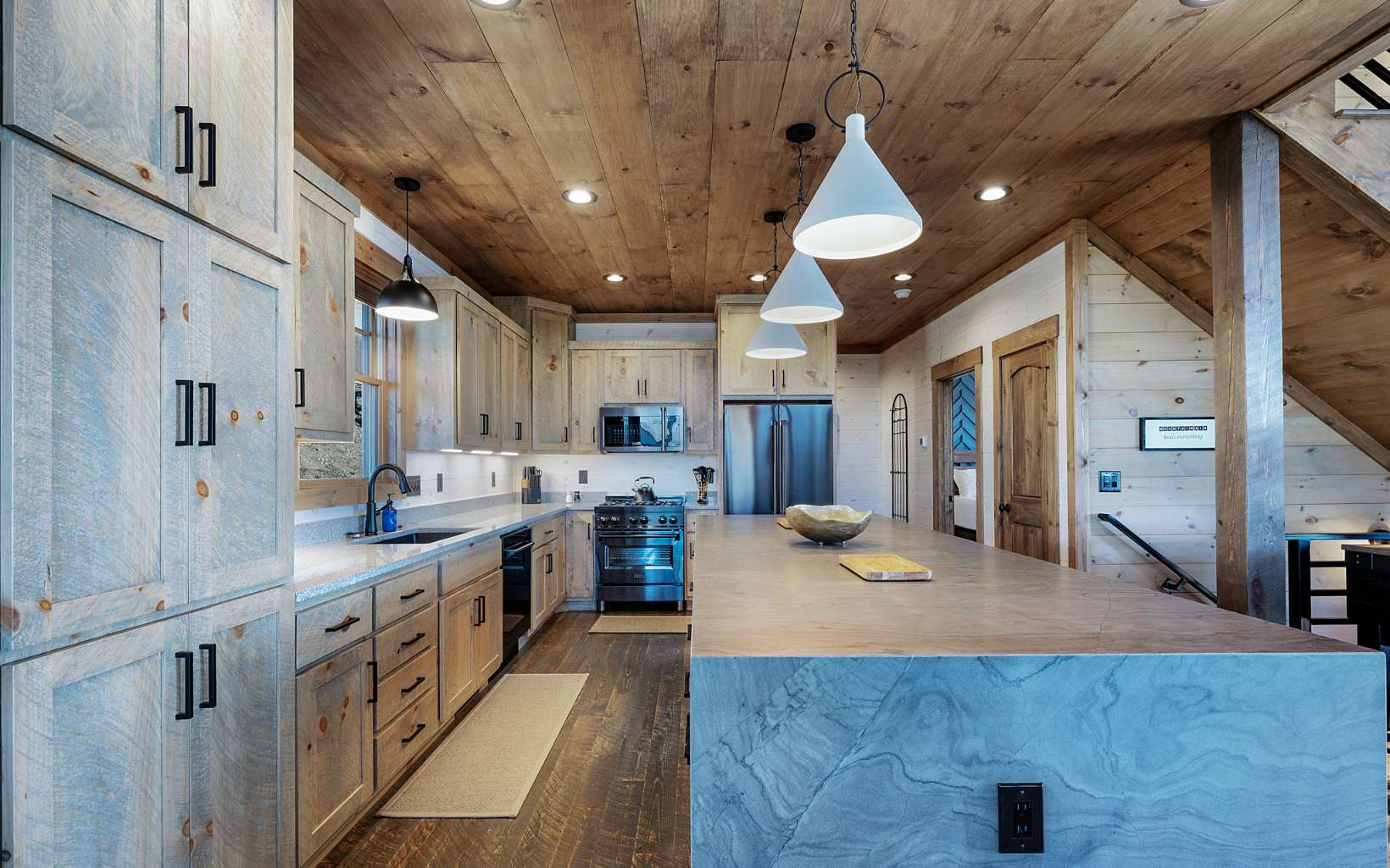 814 Overlook Drive Blue Ridge, GA 30513 - Photo 12 of 53 a large kitchen with stainless steel appliances kitchen island granite countertop a lot of counter space and a chandelier