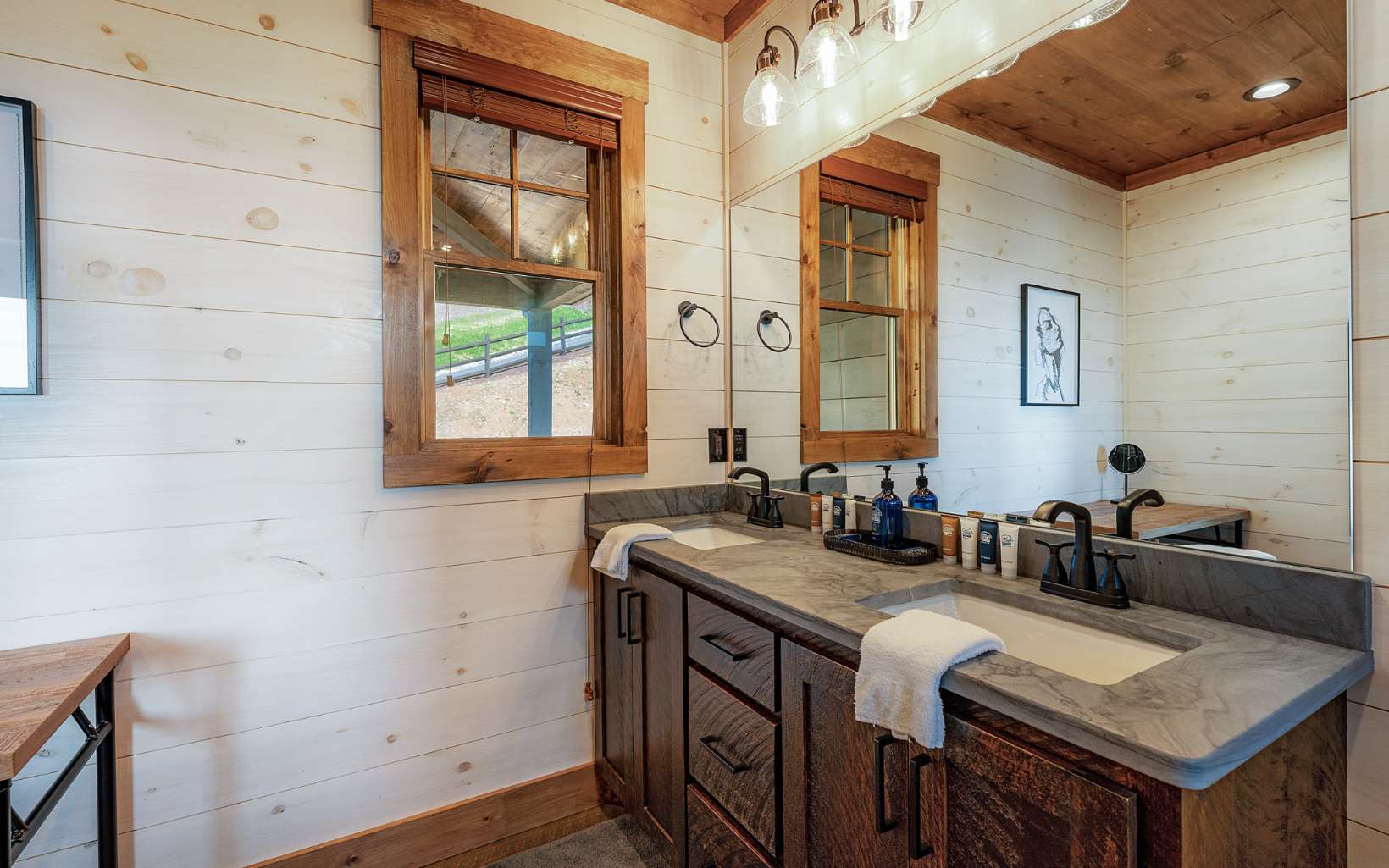814 Overlook Drive Blue Ridge, GA 30513 - Photo 17 of 53 a bathroom with a granite countertop sink a mirror a vanity and a shower