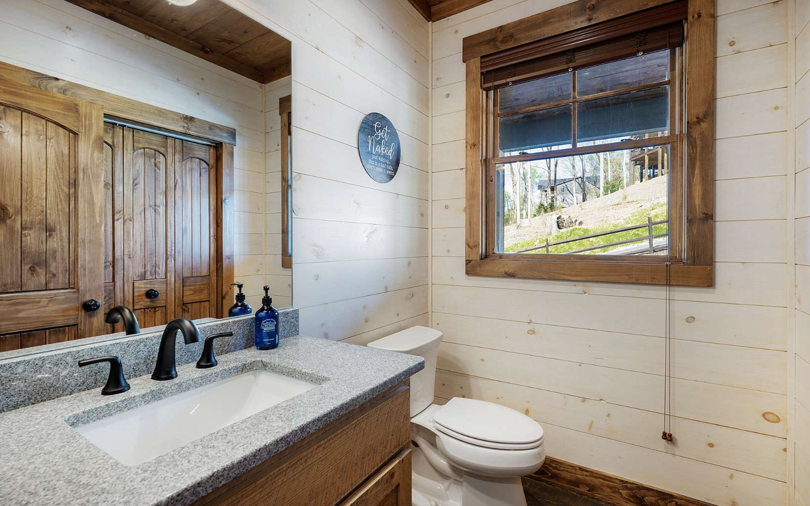 814 Overlook Drive Blue Ridge, GA 30513 - Photo 21 of 53 a bathroom with a granite countertop sink mirror vanity and toilet
