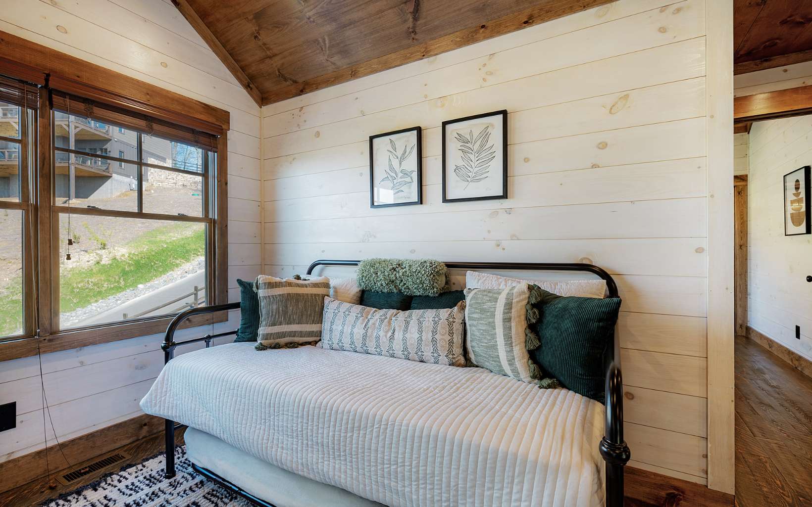 814 Overlook Drive Blue Ridge, GA 30513 - Photo 25 of 53 a bedroom with a bed and a large window